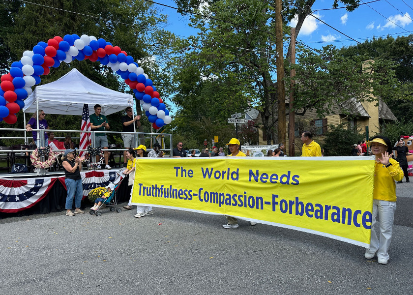 Image for article Maryland, USA: Publiczność okazuje wsparcie dla Falun Dafa podczas obchodów Dnia Pracy